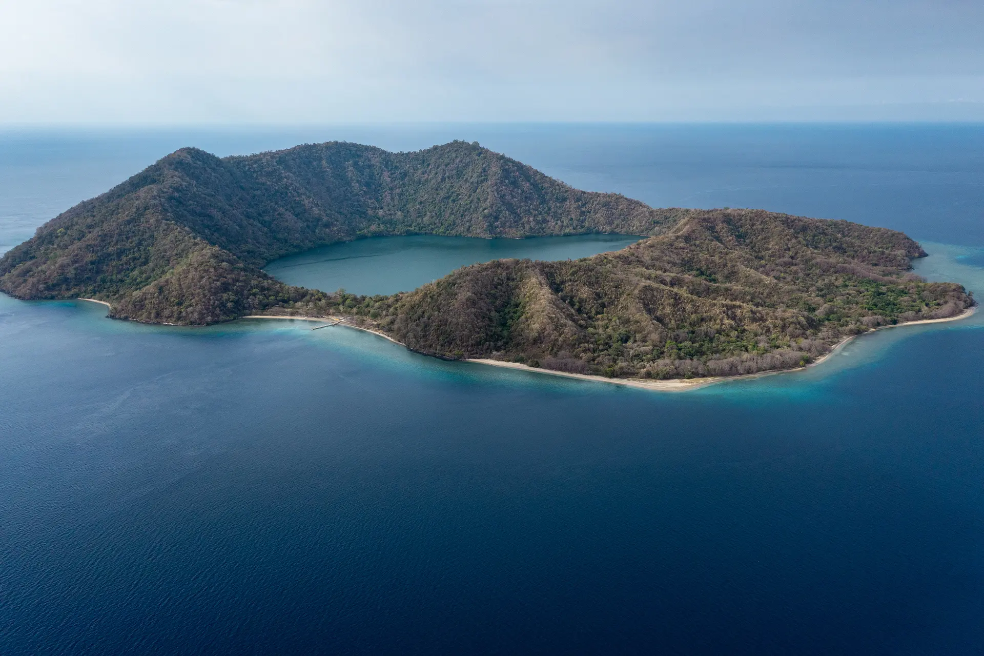 Crater lake surrounded by forest on Satonda Island