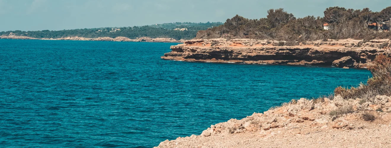 rocky shore with a small cliff in the sea 2023 11 27 04 53 12 utc 1